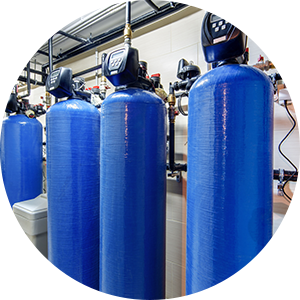 three blue tanks are lined up in a circle