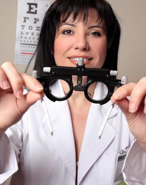eye doctor holding equipment for vision screening