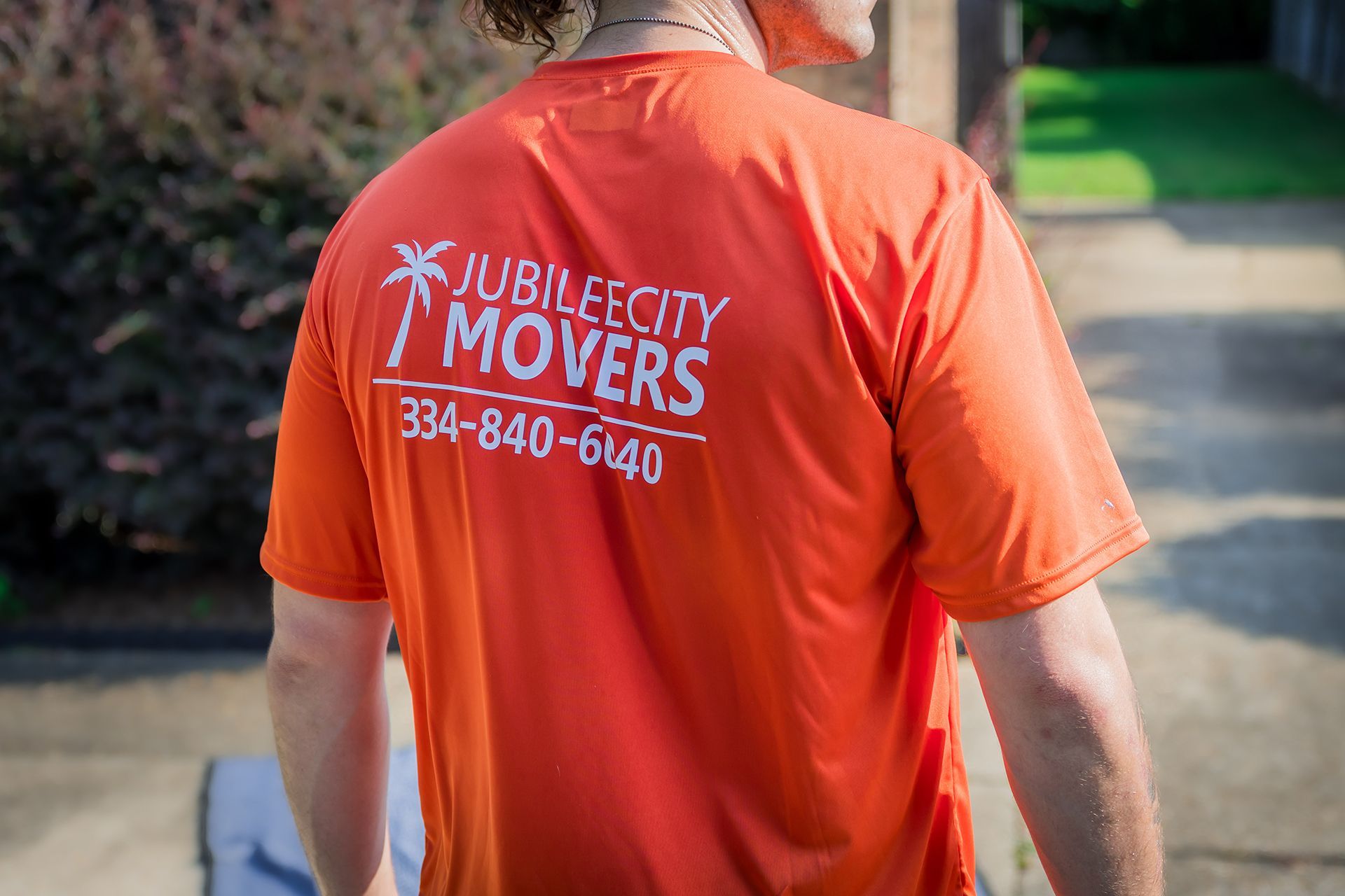The back of Jubilee City Movers' orange uniform