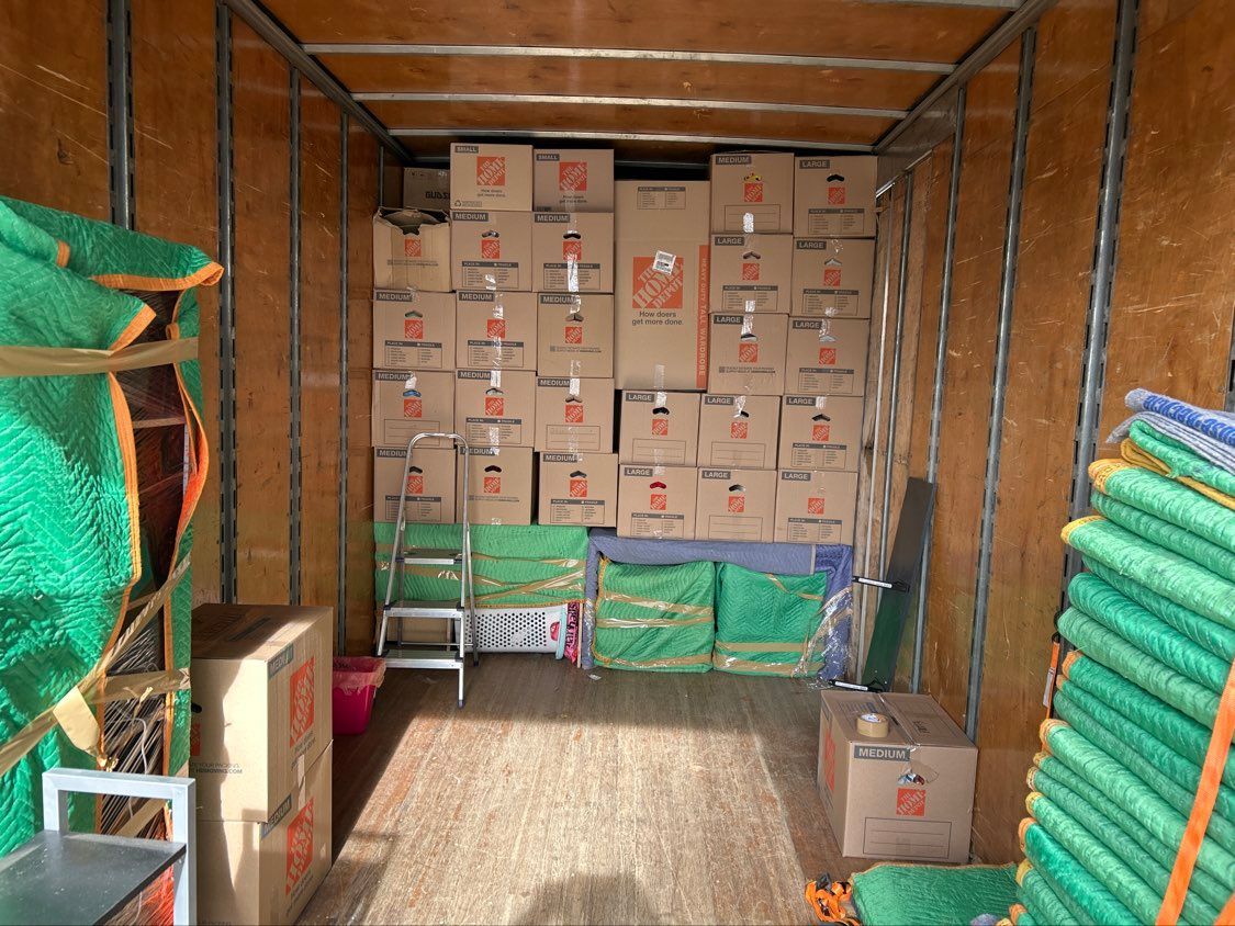 Truck trailer loaded with stacked cardboard boxes