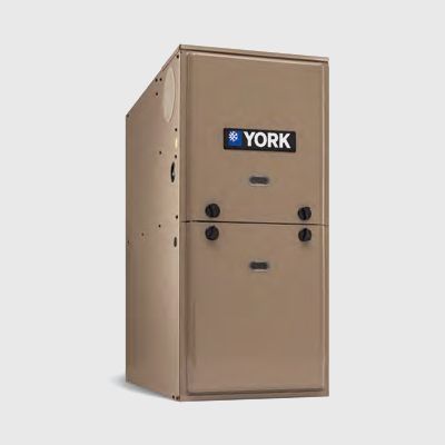 A york air conditioner is sitting on a gray surface
