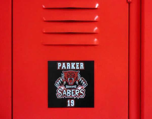 A red locker with a sticker on it that says parker sabers 19