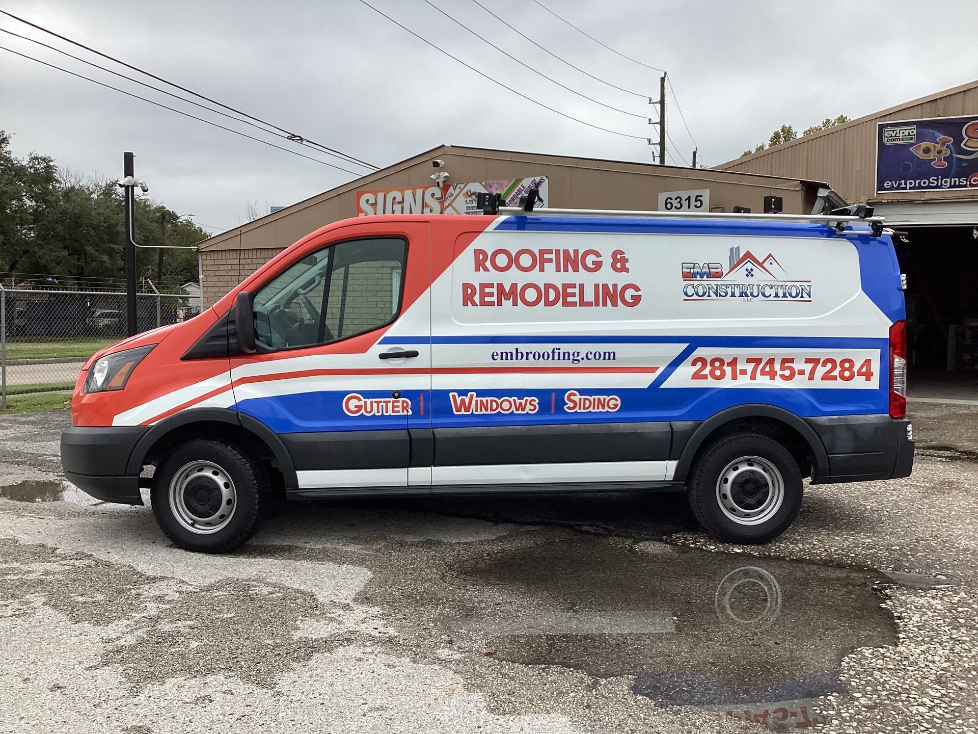 Red, white, and blue van with 