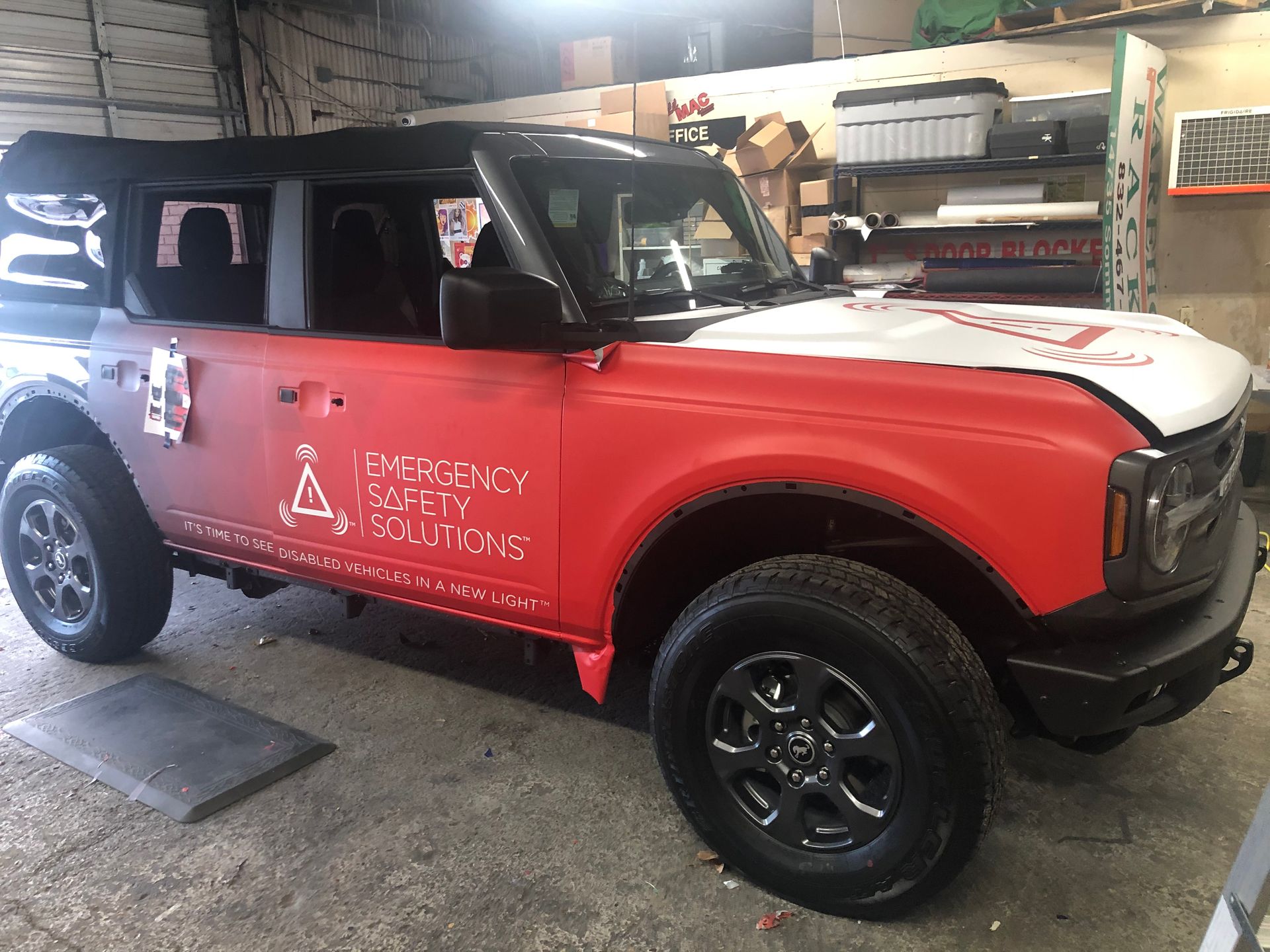 Red and white Ford Bronco with 