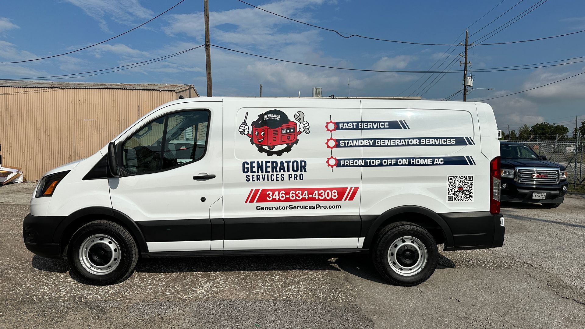 White Generator Truck Pro van with logo and contact info parked outside.