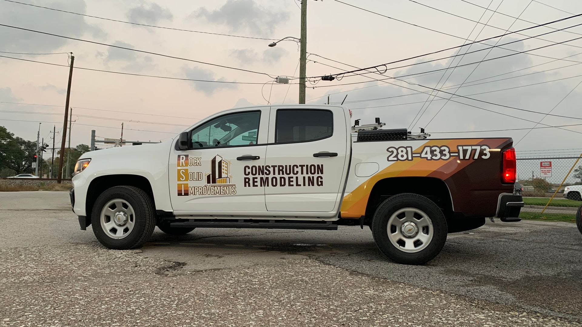 White pickup truck with company logo 