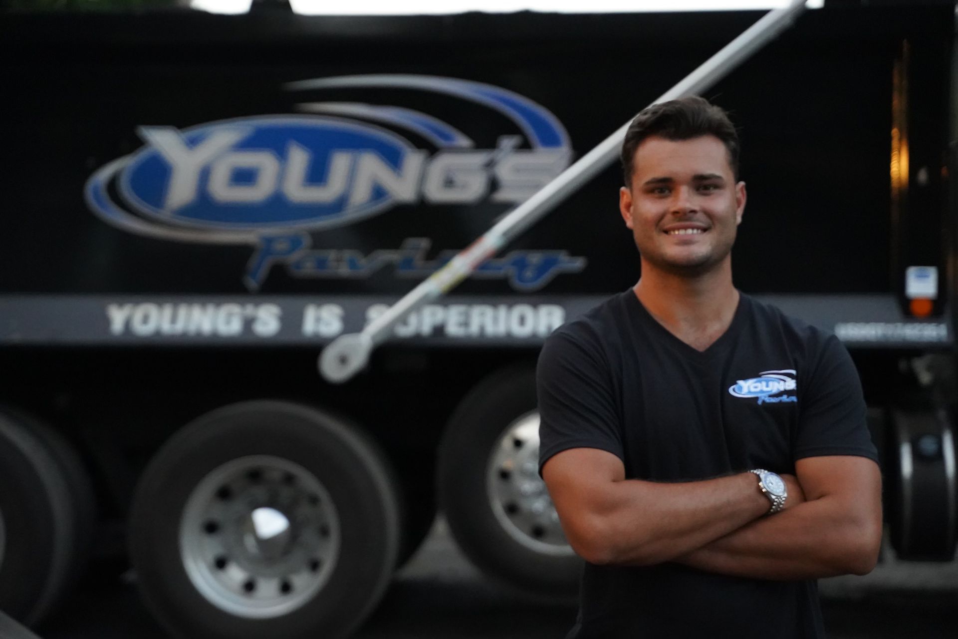 An expert in Young's Paving smiling