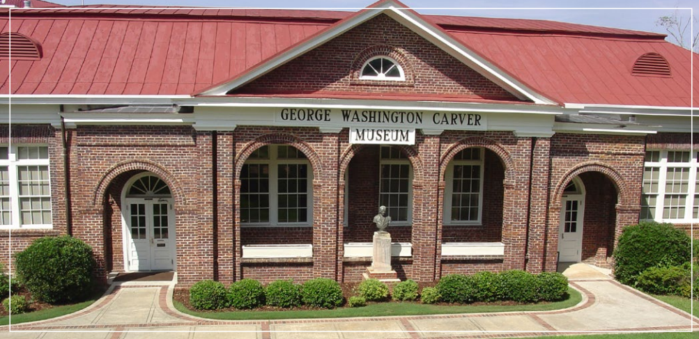 Front entrance of the O’Jays Historical Museum with red roof and brick facade