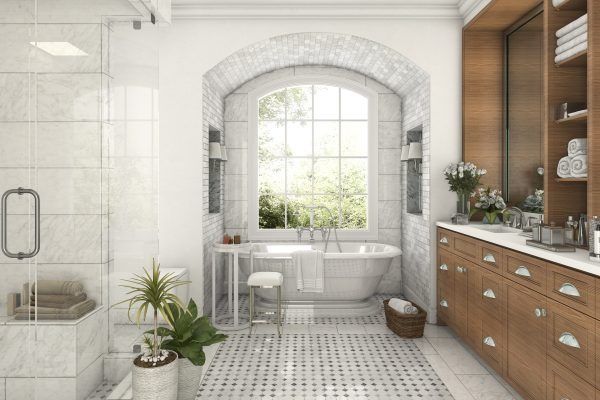 Elegant white bathroom with large arched window, soaking tub, wooden cabinets, and plants.