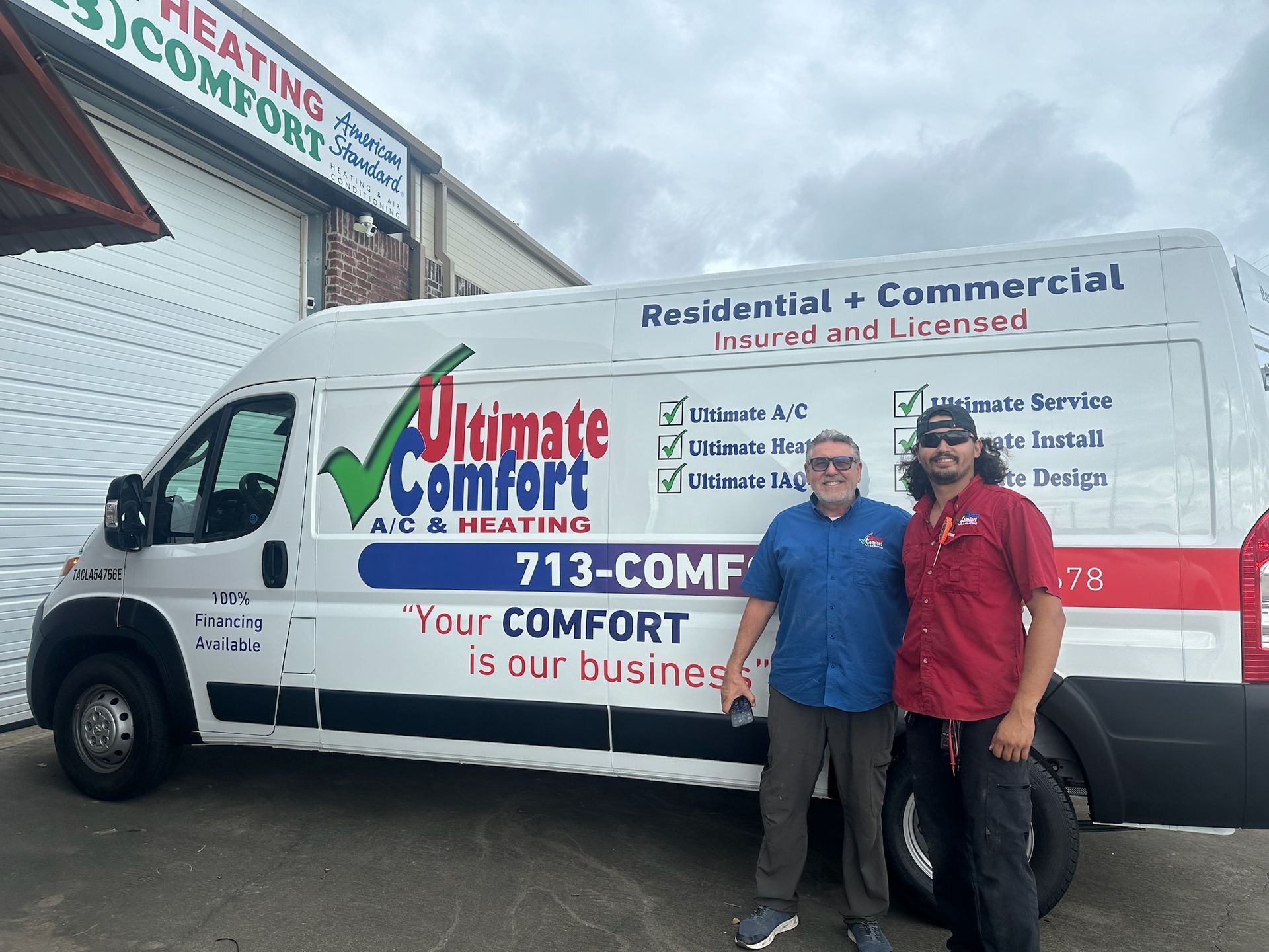 Two men stand next to a white van with 
