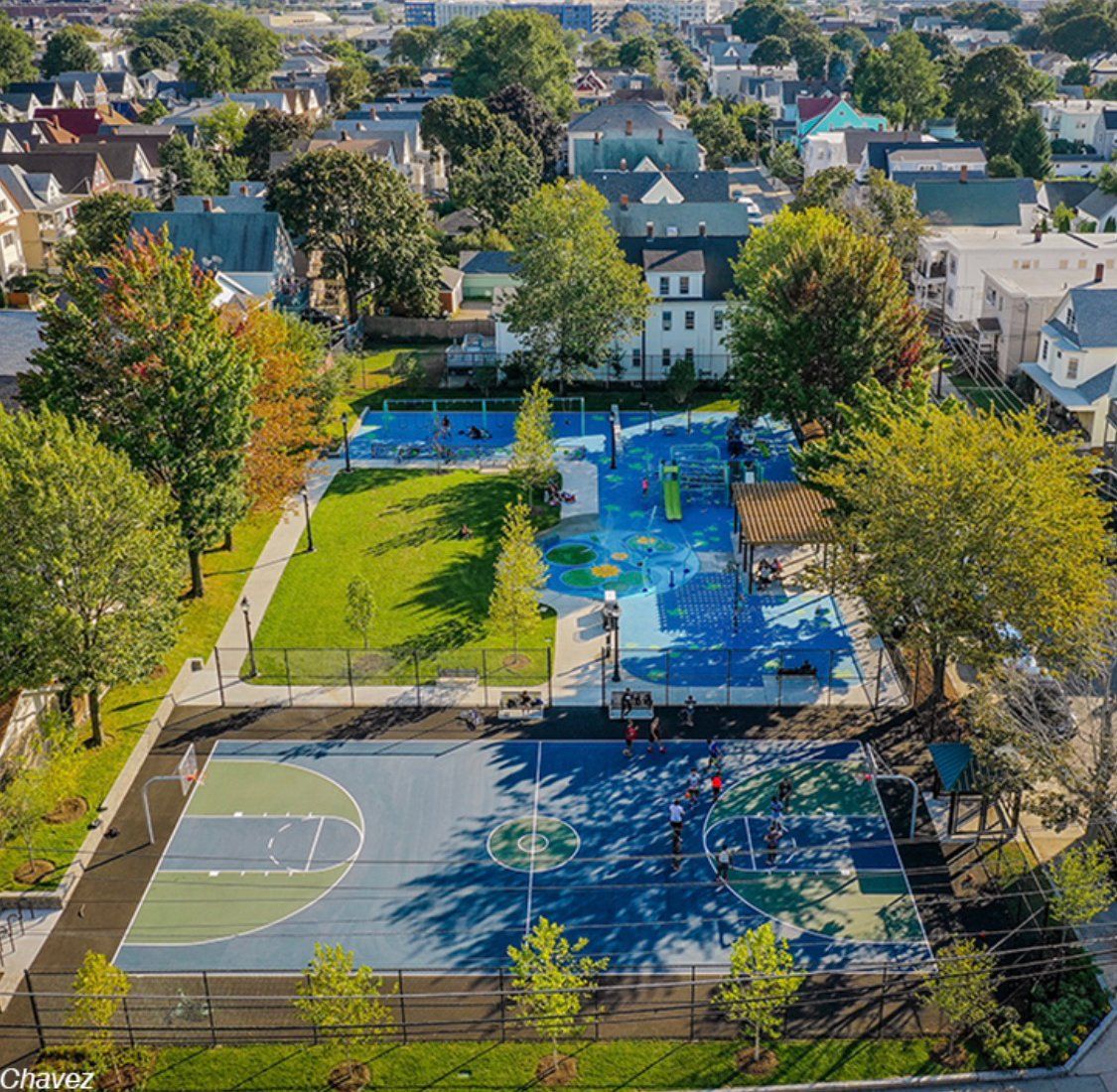 An aerial view of a basketball court in a park