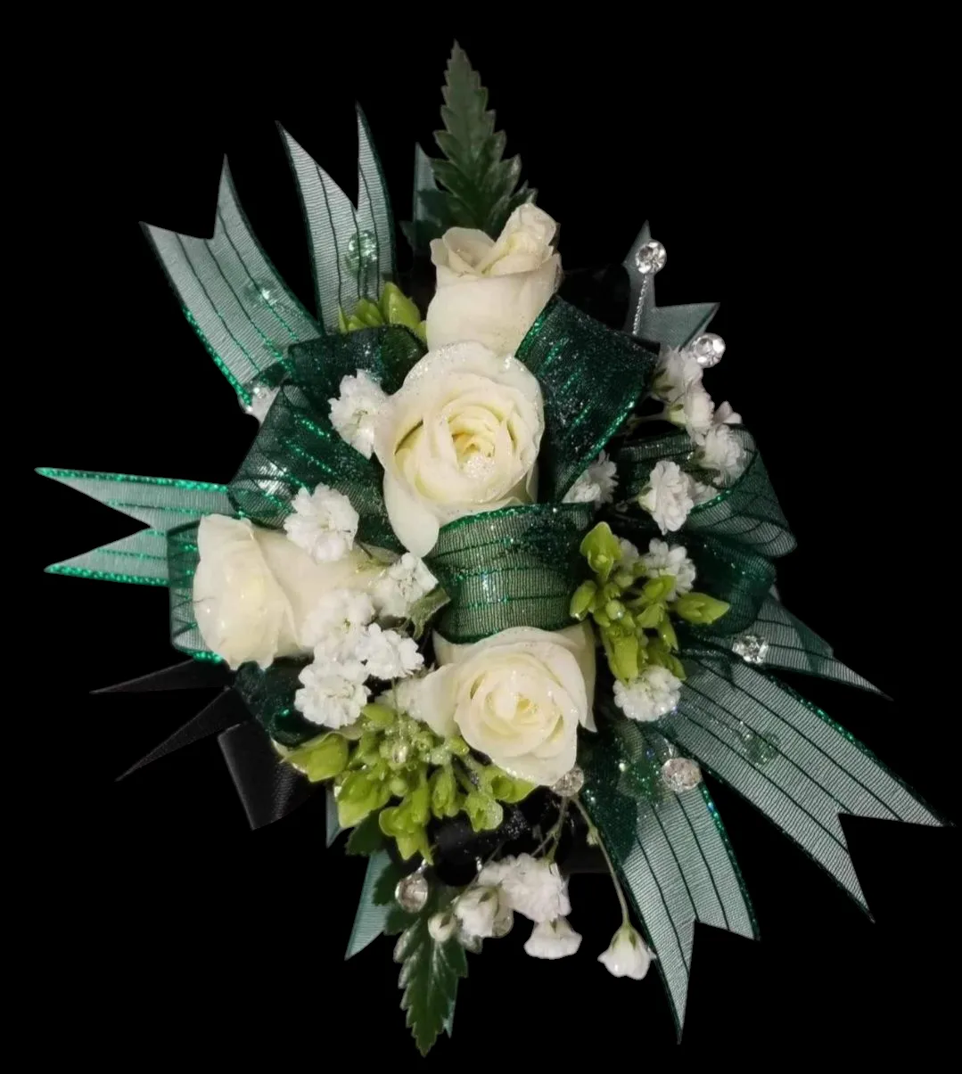 White roses and baby's breath floral arrangement with green ribbon on a black background.