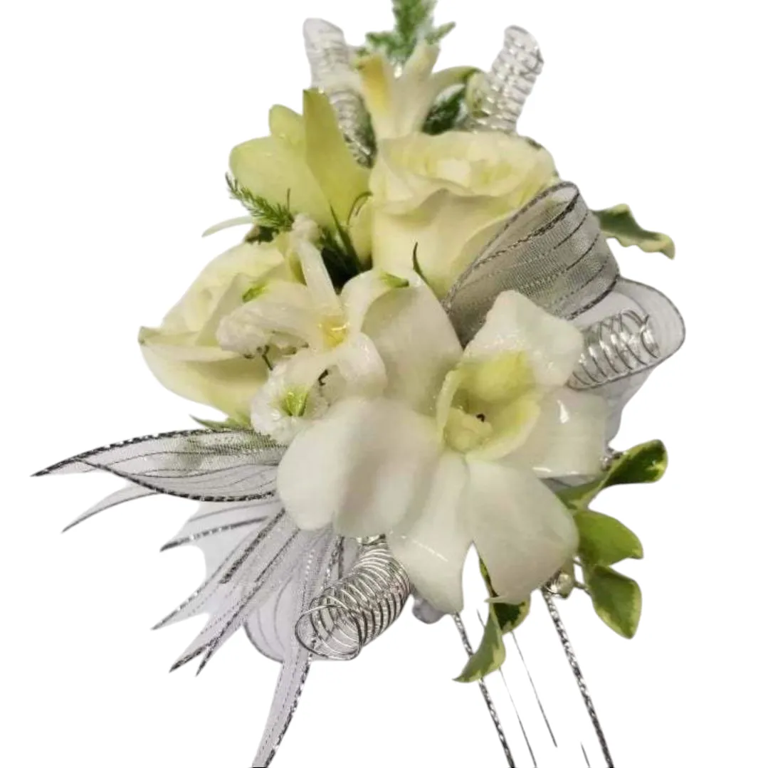 White floral corsage with ribbon and green accents.
