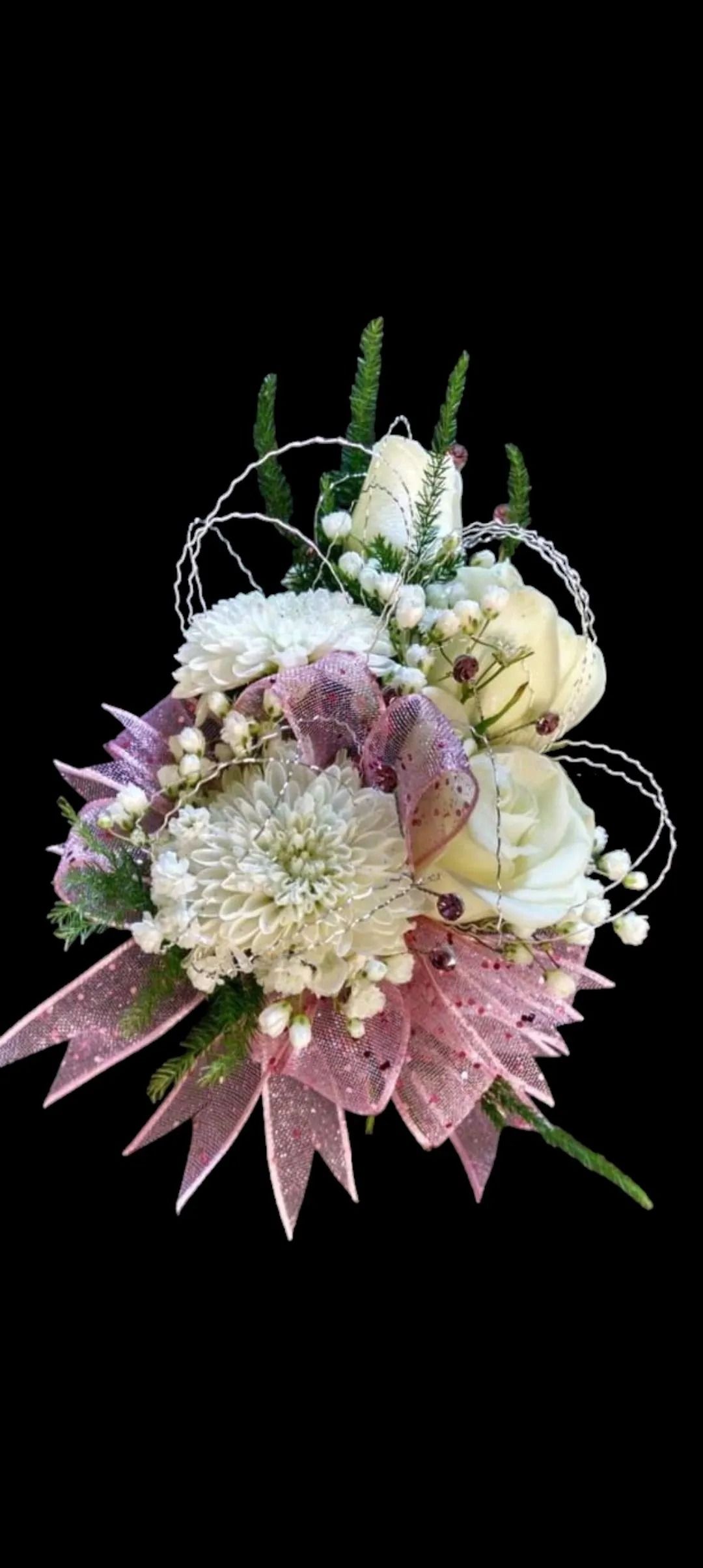 A bouquet of white, purple, and yellow flowers with a pink bow against a black background.