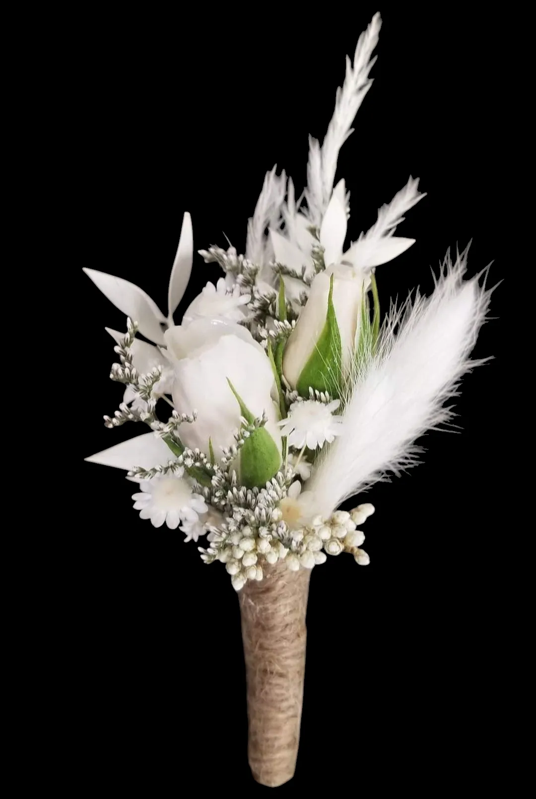 White floral boutonniere with a burlap-wrapped stem. Features roses and feathery accents on black background.