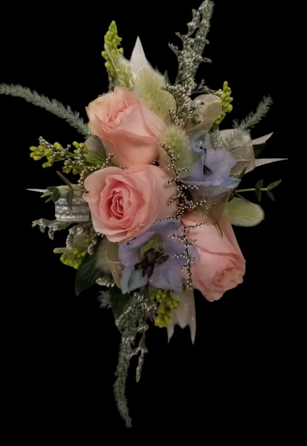 Pink roses and blue flowers in a small bouquet, with decorative silver accents on a black background.