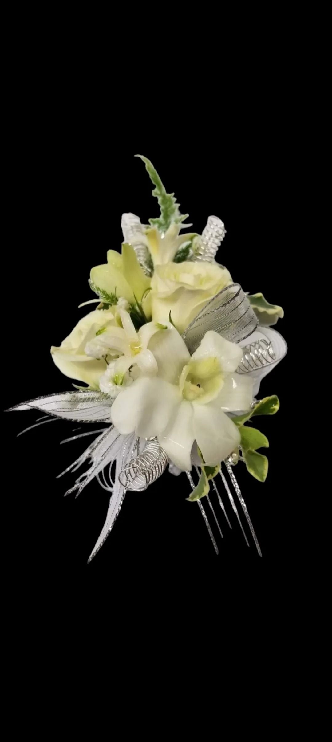 White and yellow floral hair comb on black background.