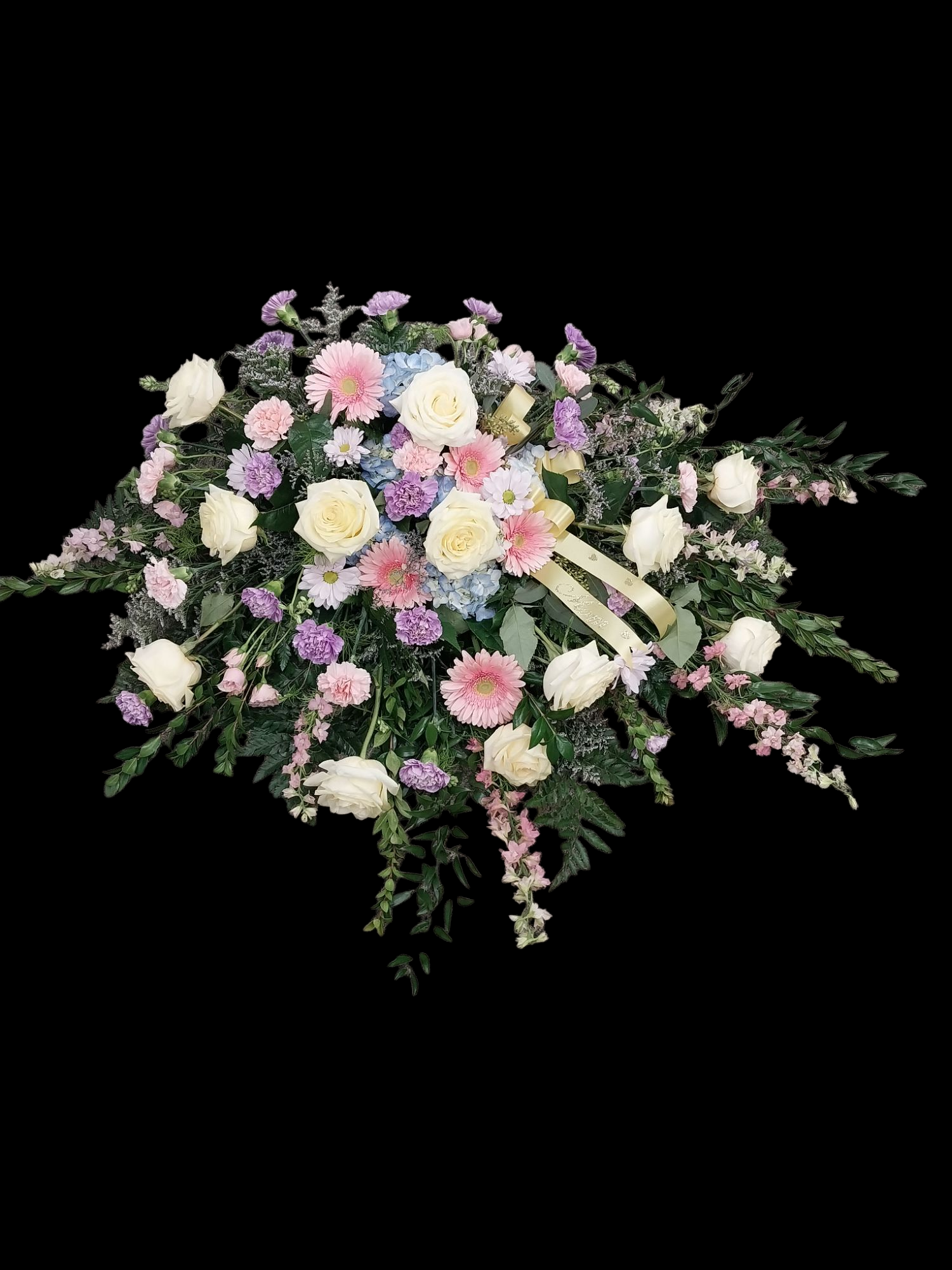 Floral arrangement of white, pink, and purple flowers with greenery and a yellow ribbon on a black background.