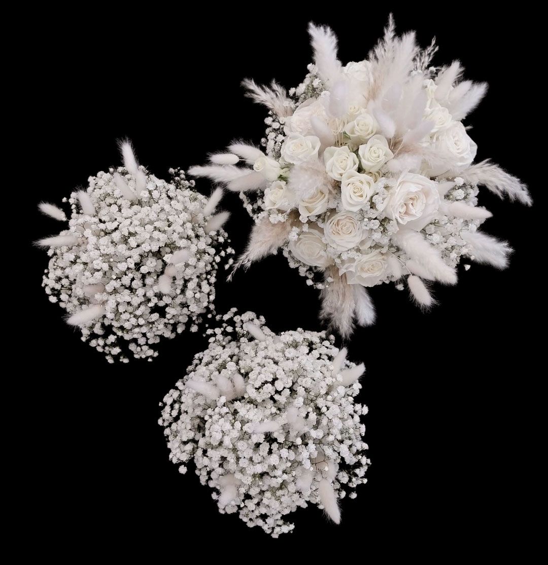 Three white flower arrangements on black background.