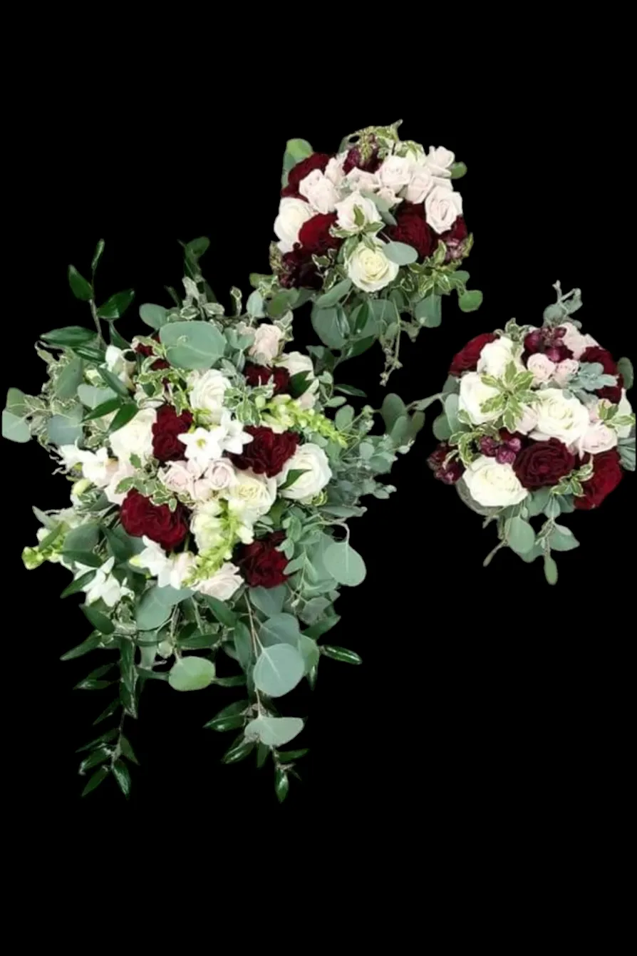 Three bouquets: red and white flowers with green foliage against a black background.