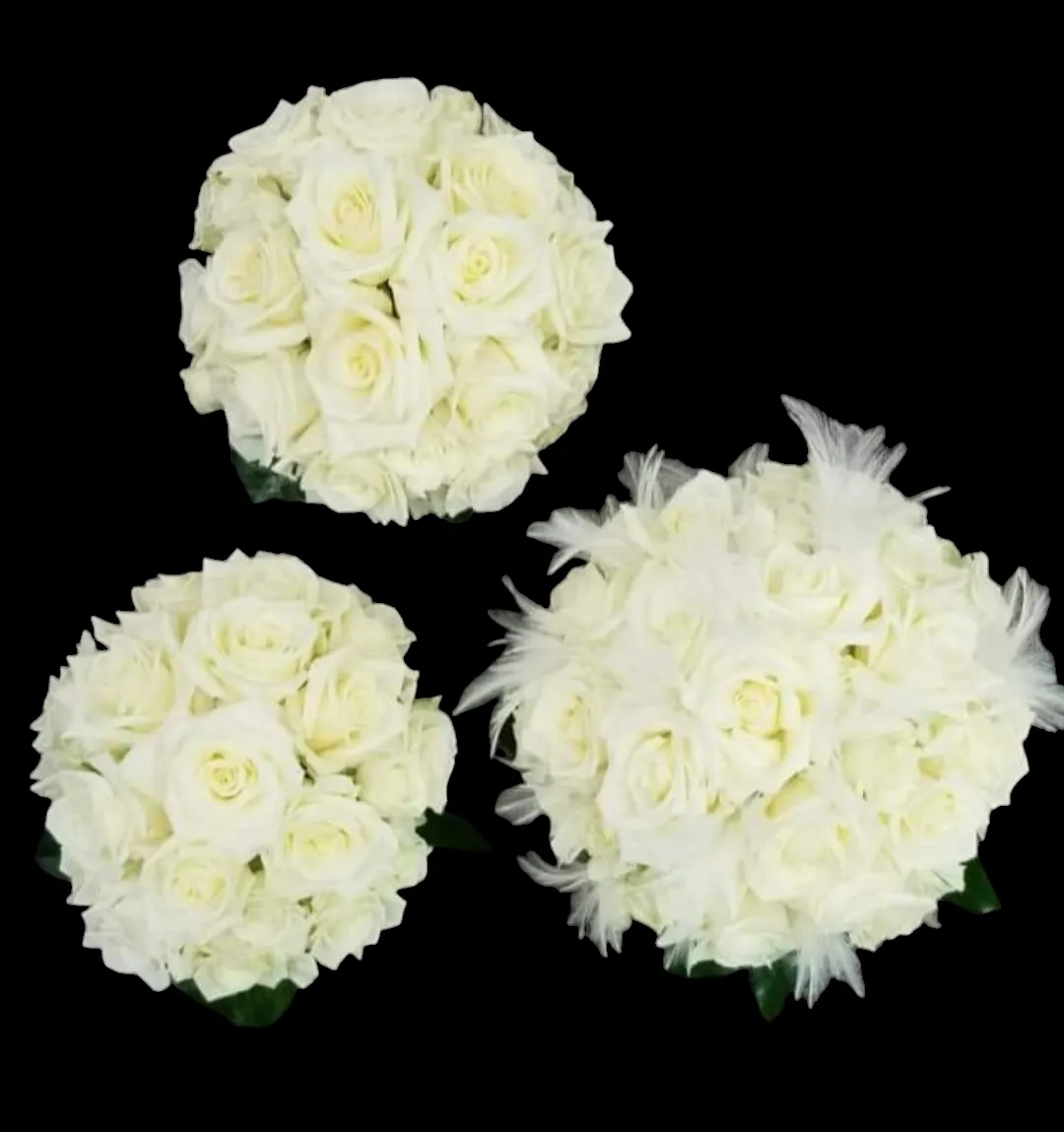 Three white rose bouquets on a black background; one with feathers.