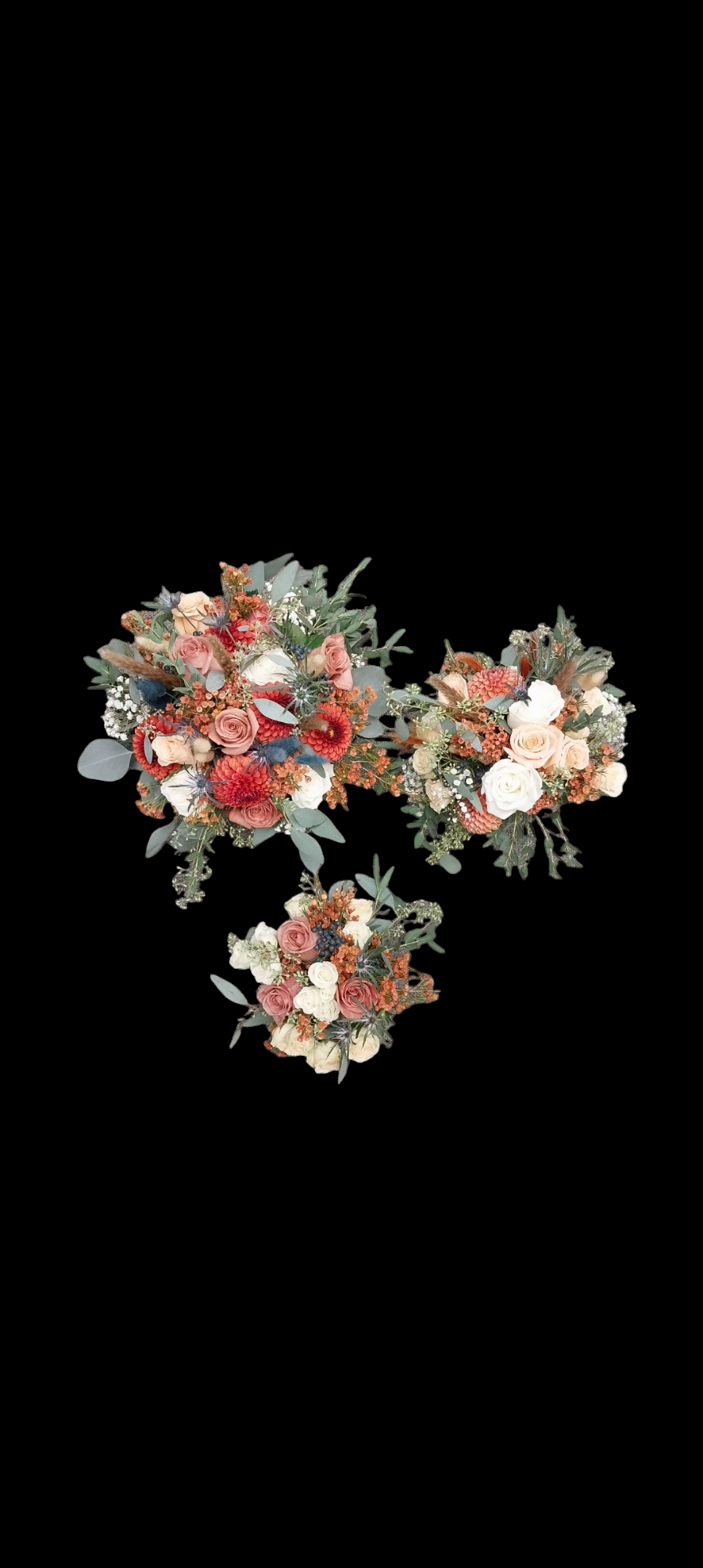 Three bouquets with peach, red, and cream flowers against a black background.