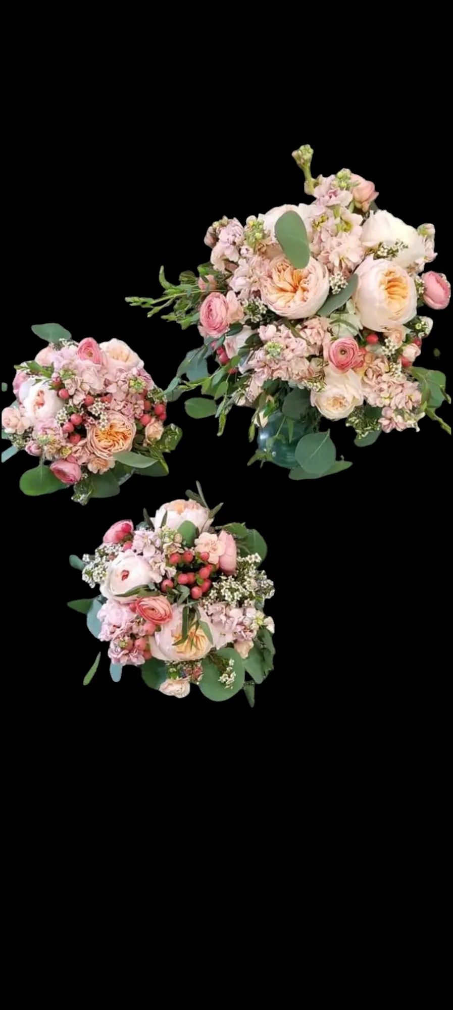 Three bouquets with pink and cream flowers on a black background.