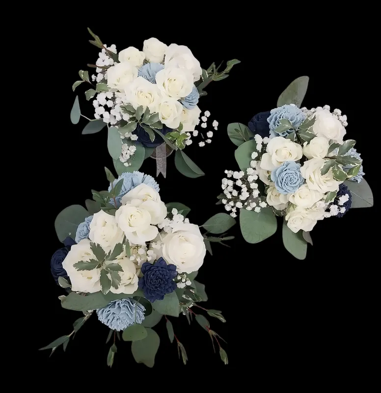 Three bouquets of white and blue flowers with greenery.