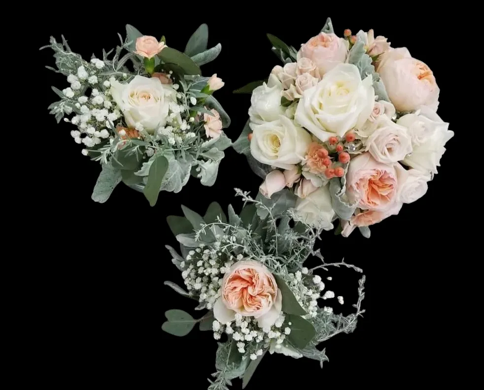 Three bouquets of white and peach roses with greenery on a black background.