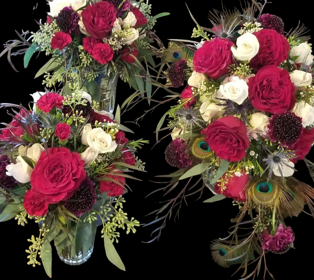 Three bouquets of red roses, white flowers, and peacock feathers against a black background.