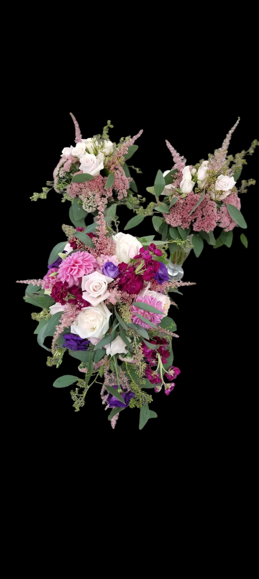 Three bouquets of white, pink, purple, and burgundy flowers on a black background.