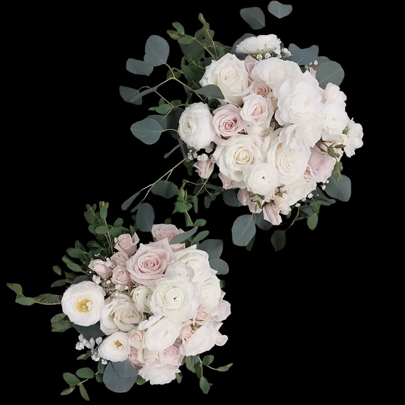 Two floral bouquets: white and blush roses with eucalyptus on a black background.