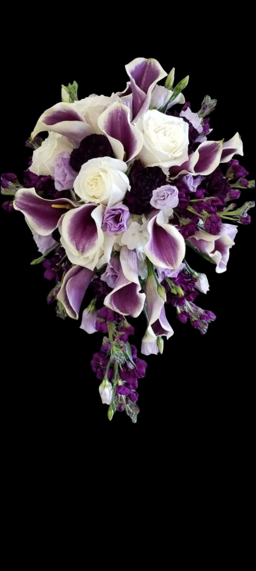 Purple and white cascading bouquet against a black background.