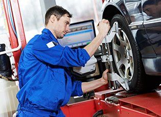 Mechanic fixing car tyre