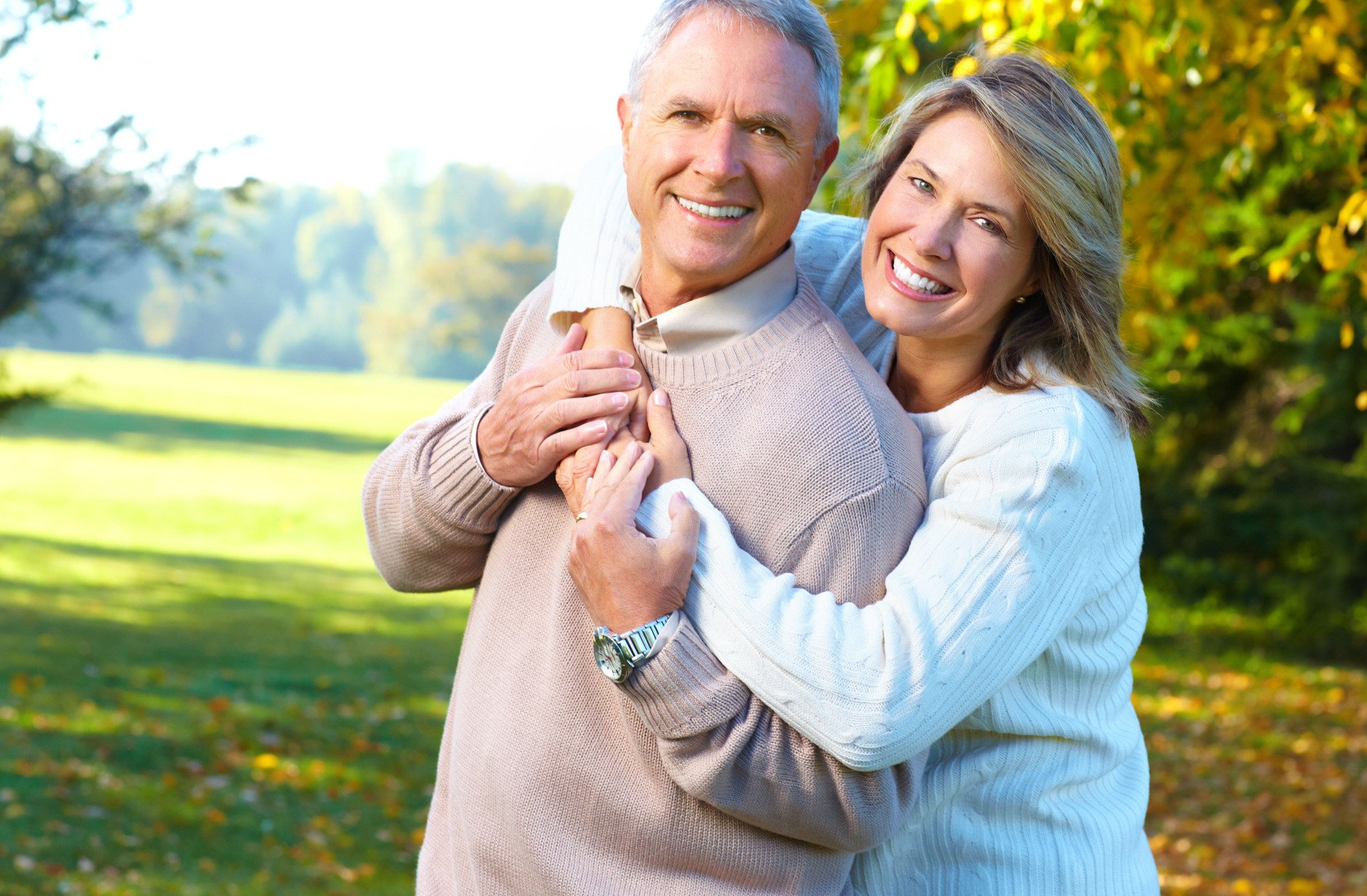 Mother and daughter showing white teeth