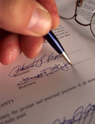 Attorney signing on a business paper