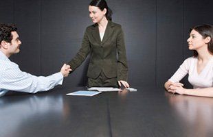 Divorced couple shaking hands