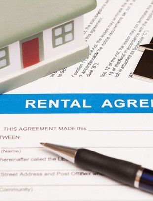 Rental agreement form paper and a pen
