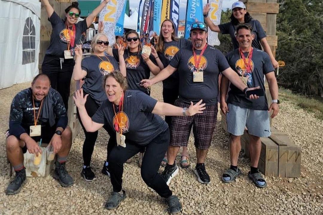 A group of people are posing for a picture together.