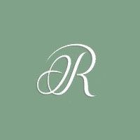 A stylized, white cursive letter 