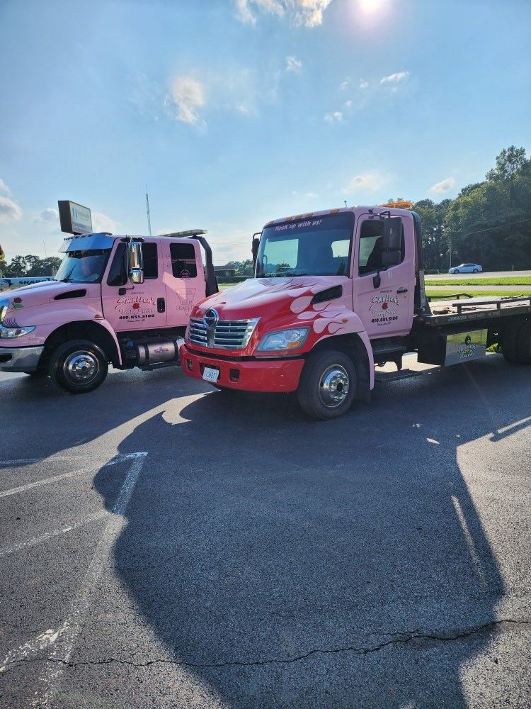 Pink flatbed tow trucks