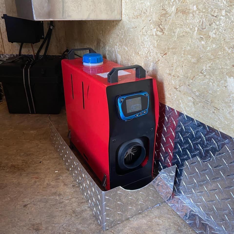 A red and black box with a blue bottle on top of it