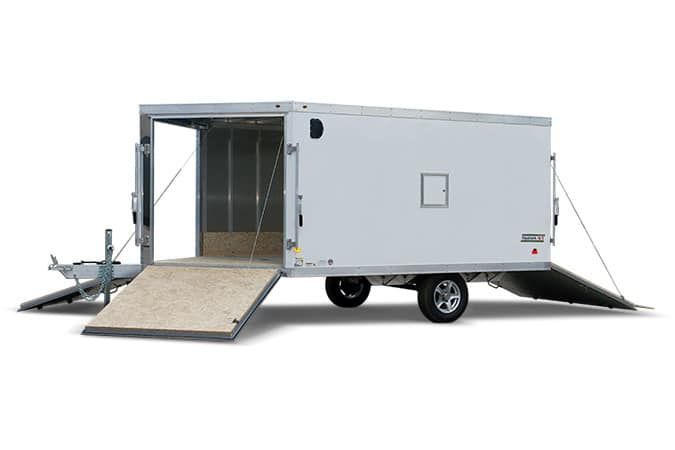 A white trailer with a ramp attached to it on a white background.