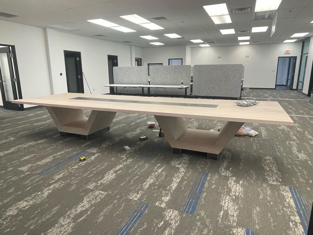 There is a long table in the middle of the room.