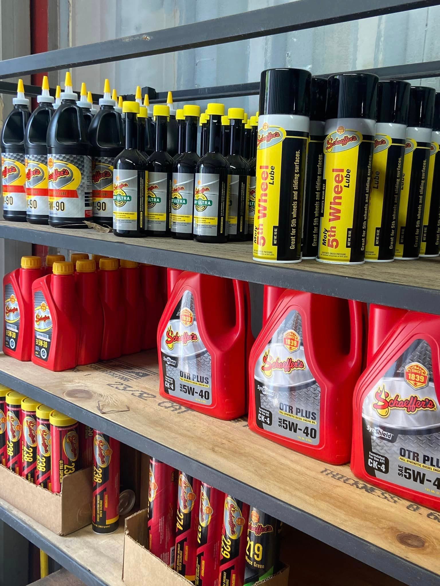 A store shelf filled with lots of bottles and bottles of oil