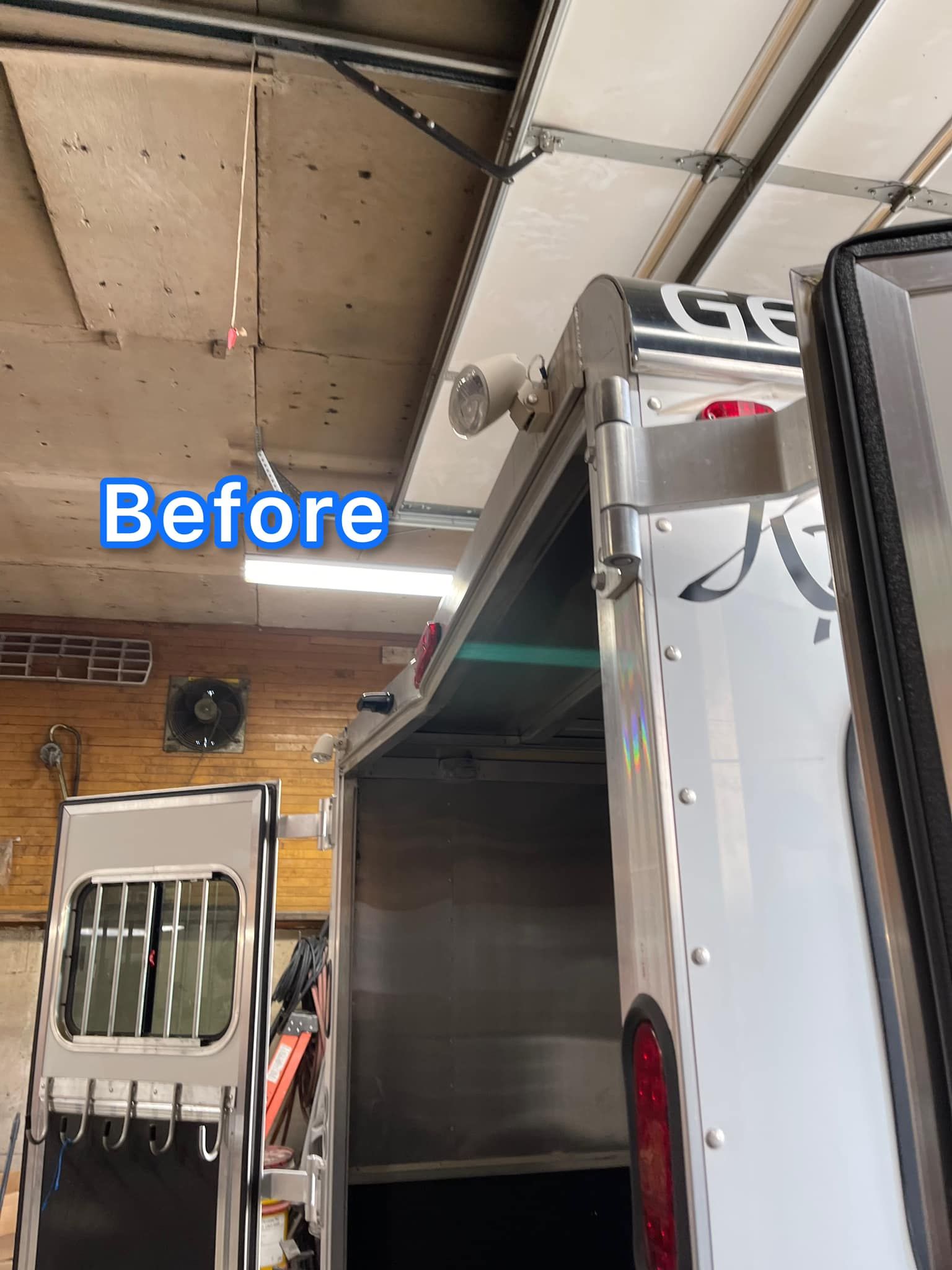 A before picture of a trailer in a garage