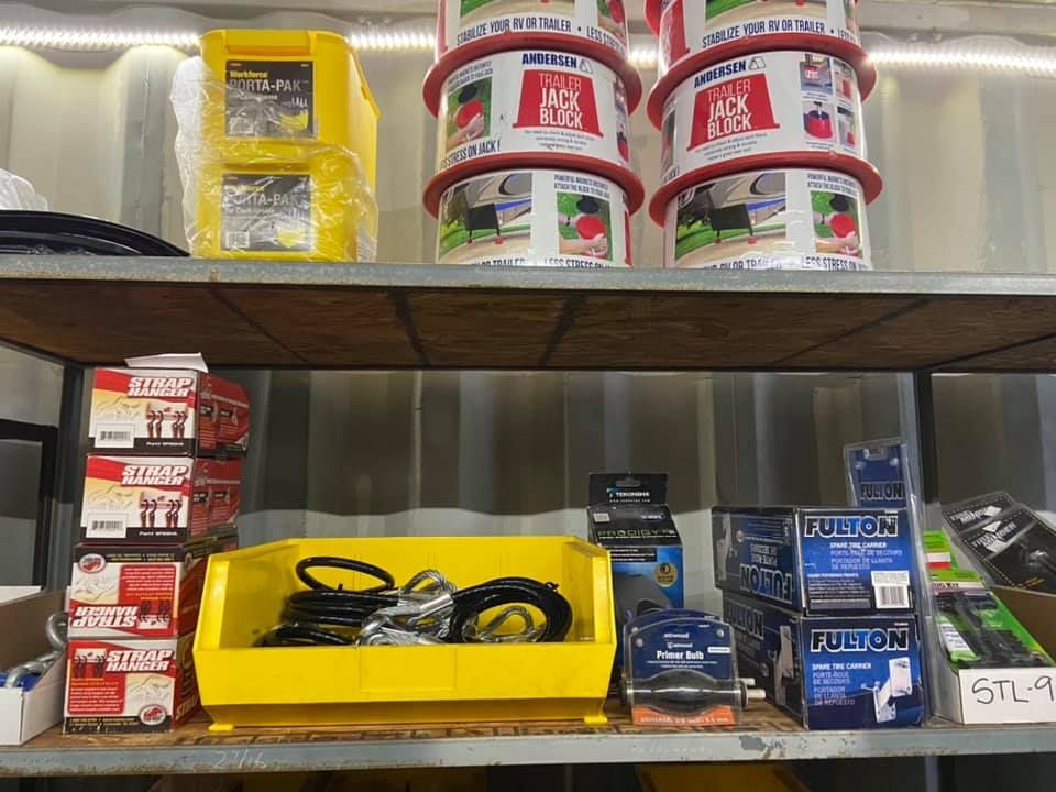 A shelf with a bunch of boxes on it