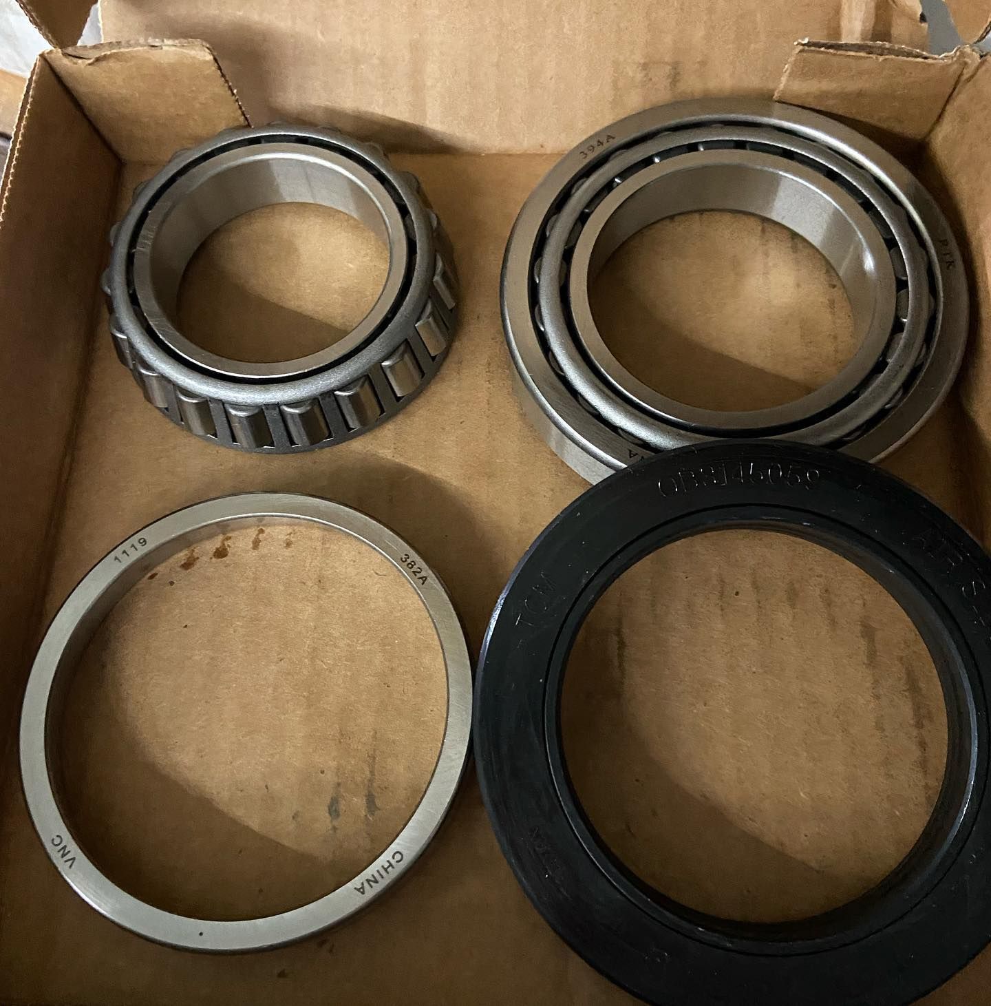 A box of bearings and seals with one bearing being made in china