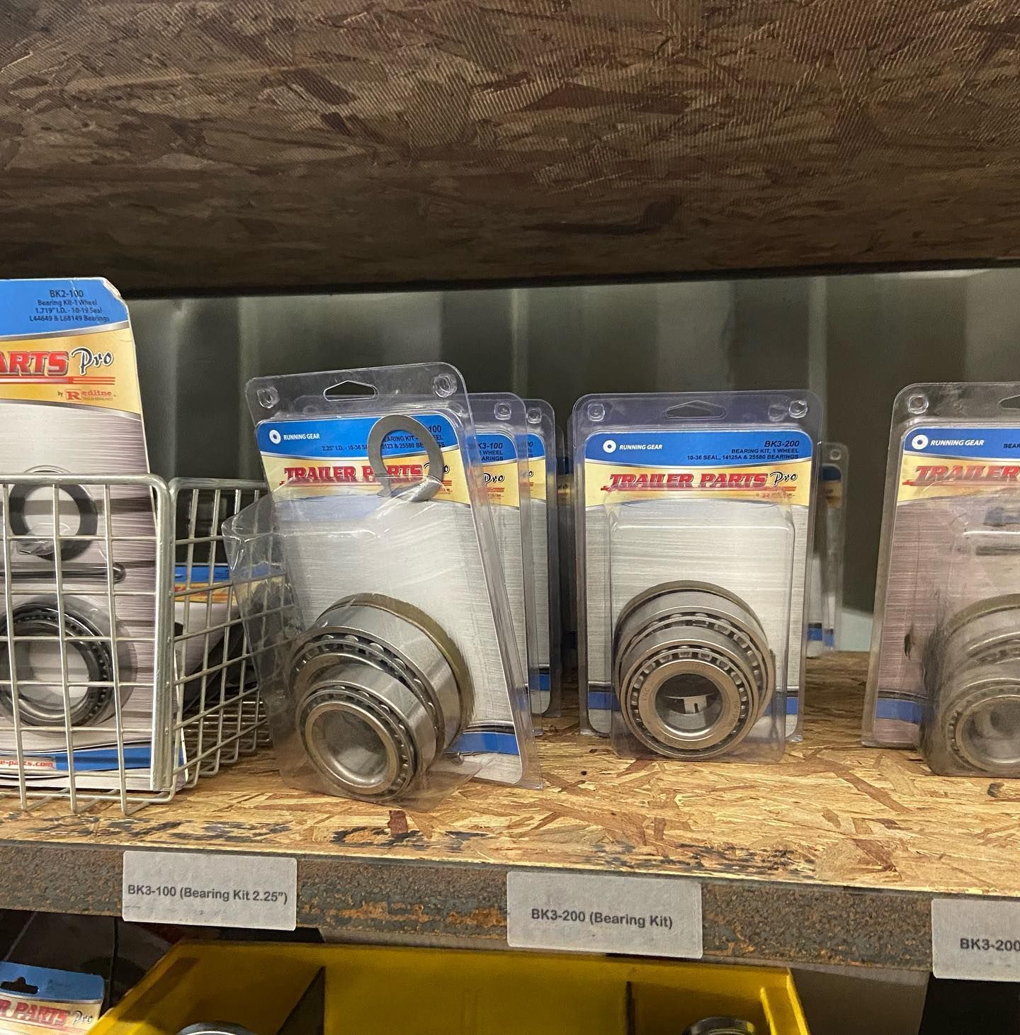 A bunch of bearings are lined up on a shelf