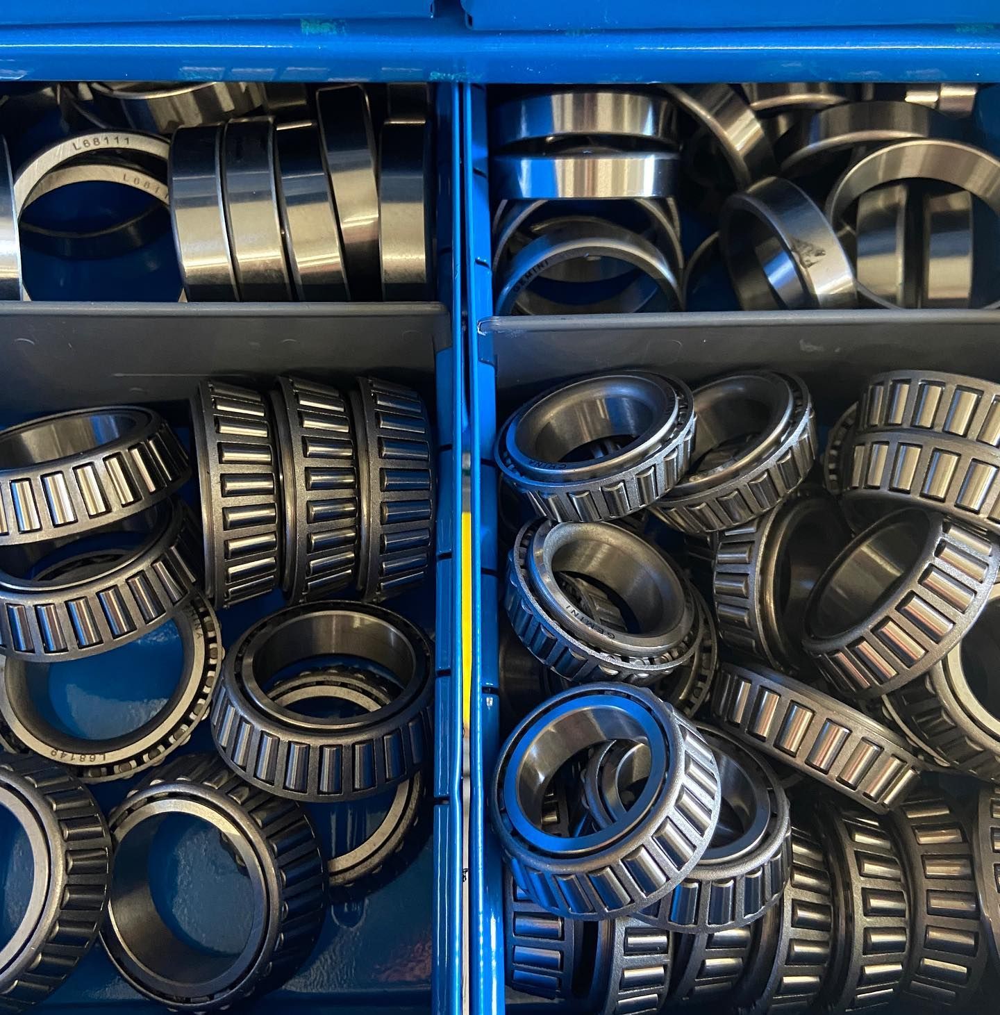 A blue box filled with bearings and rings